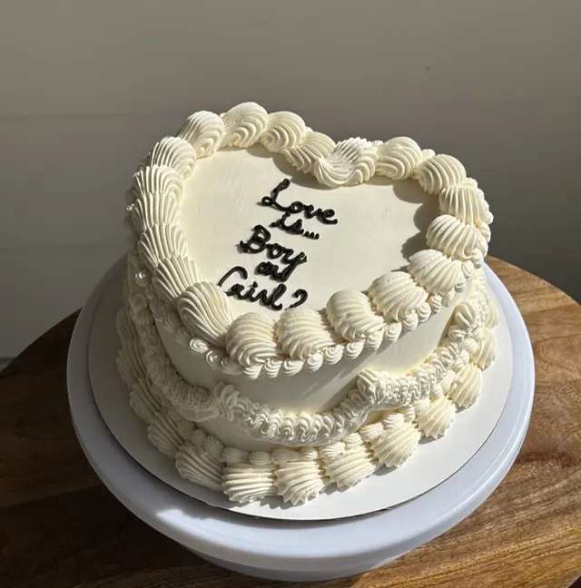 Ivory heart cake asking "Boy or Girl?"