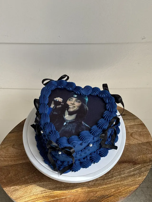 Navy heart cake with an edible photo, black bows and pearls