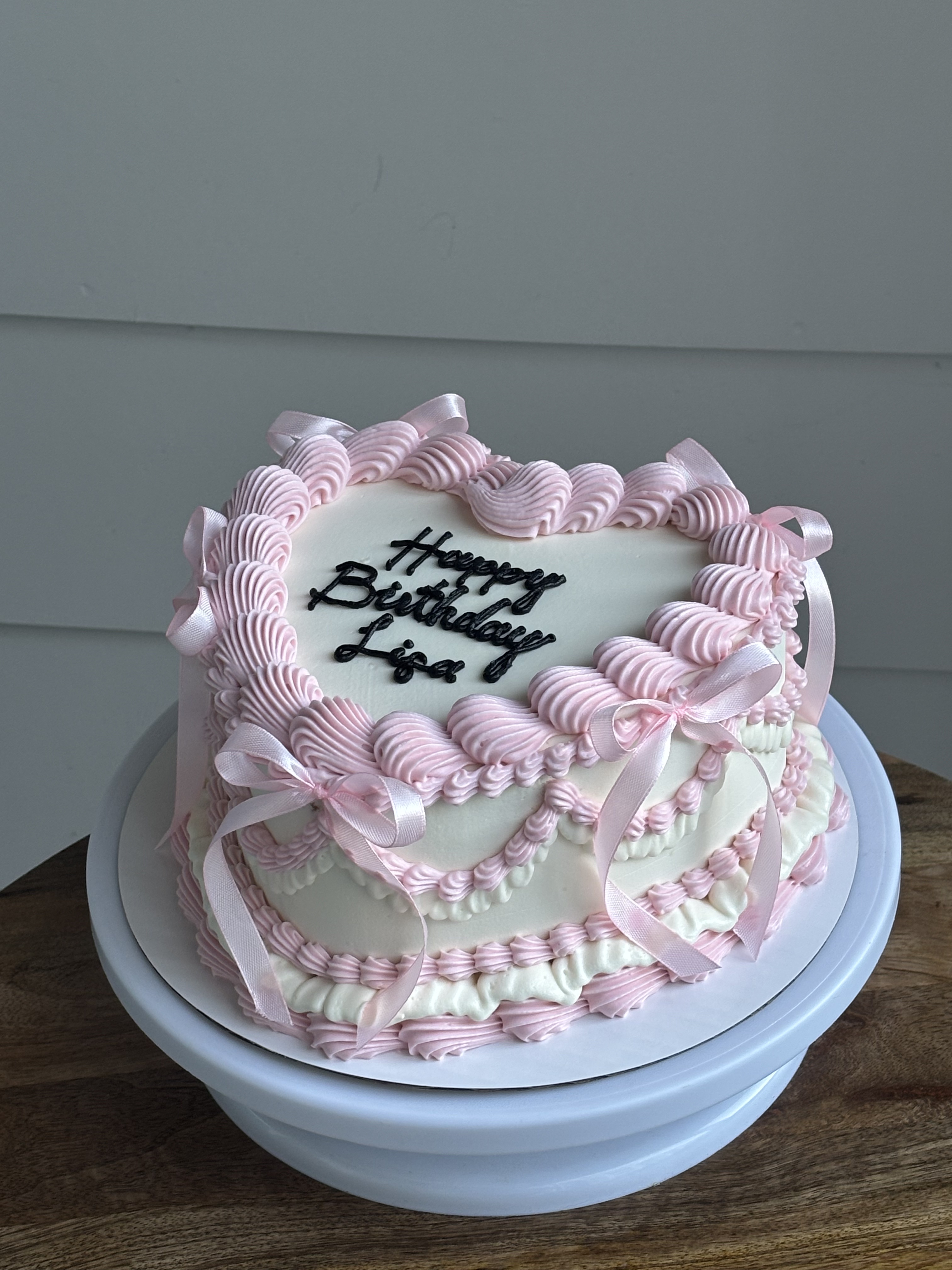 Pink white birthday heart cake