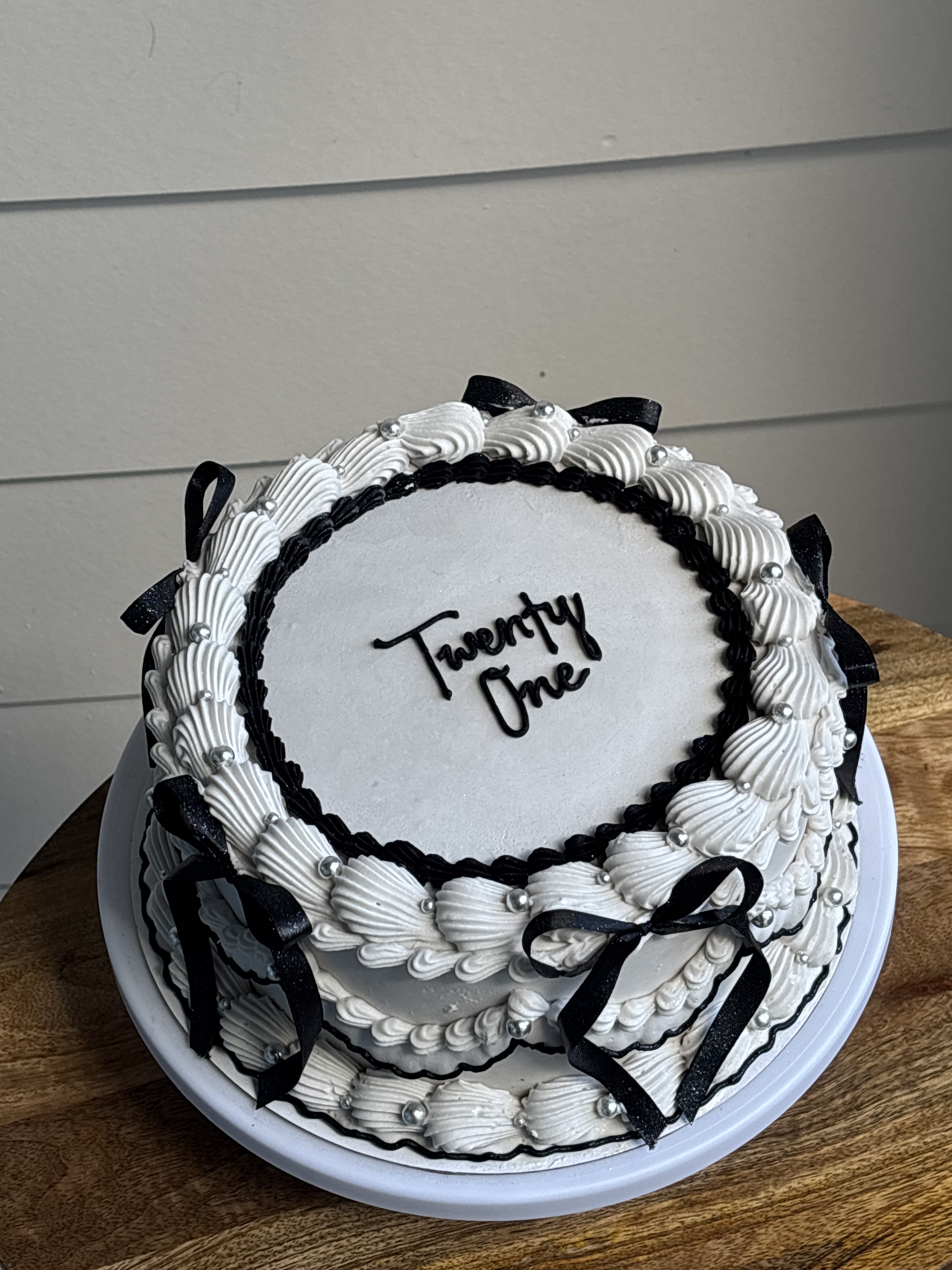 White black twenty one round cake